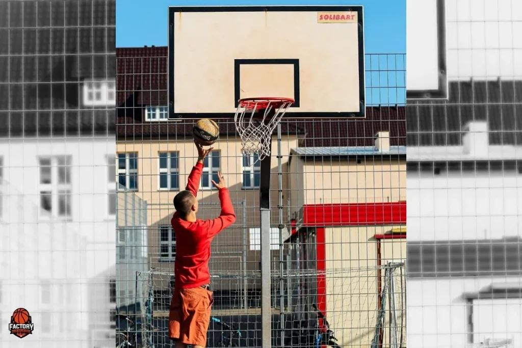 Athlete practising a one-handed form shot close to the basket