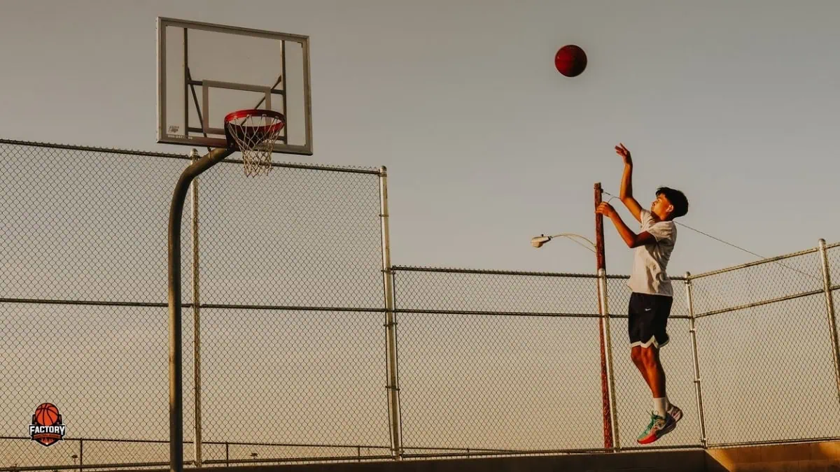 Basketball Player Practising Shooting Youth basketball player practising shooting form